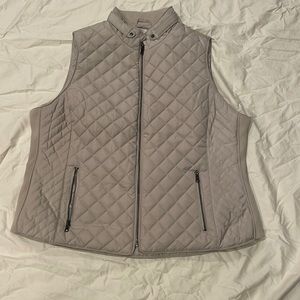 Tan zippered vest never worn. 2 full functioning pockets.